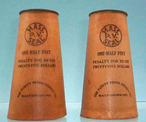 Photo of Purity Paper Milk Cartons, tan waxed cones with paper disk tops.